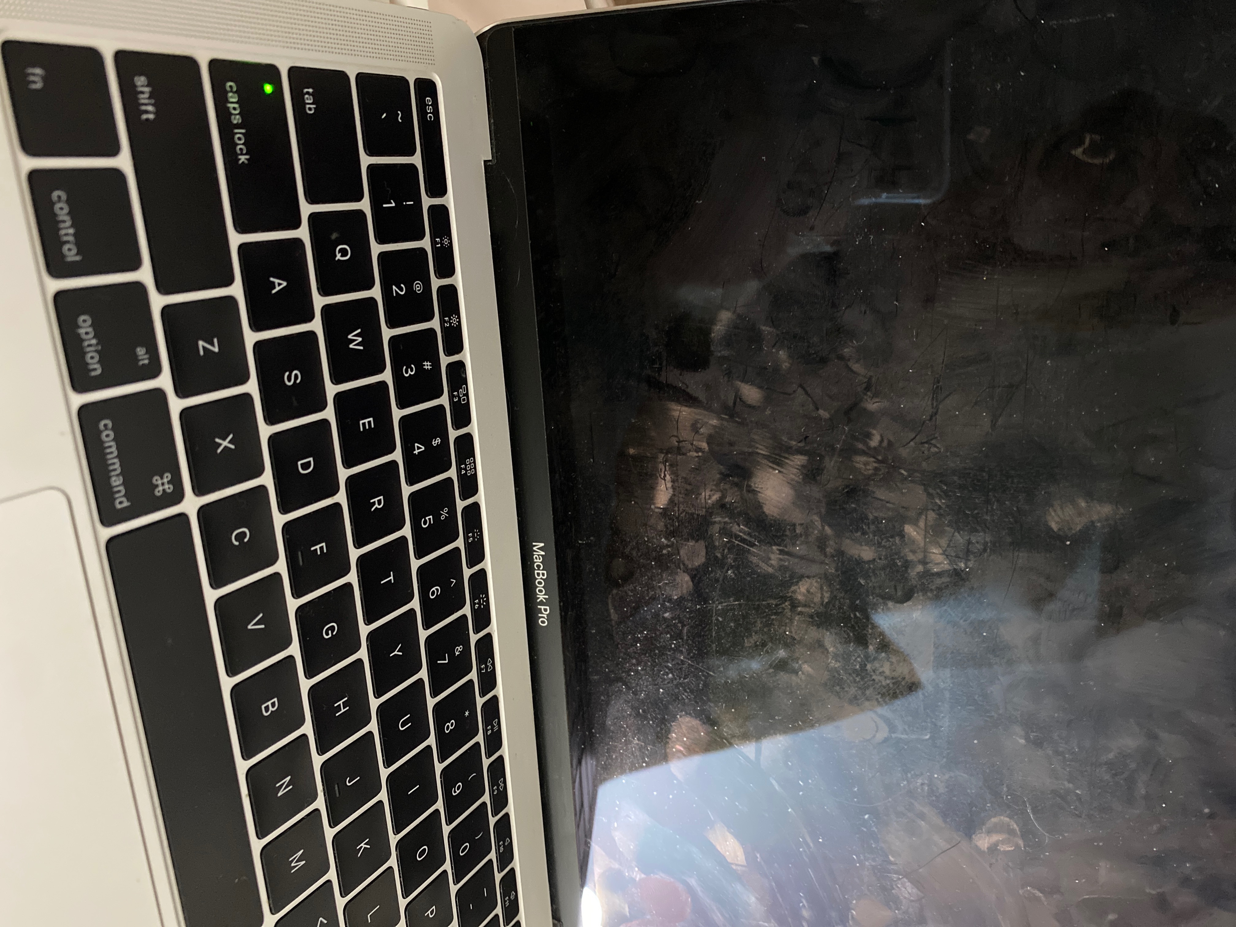 Black screen MacBook Pro, green Caps Lock… - Apple Community