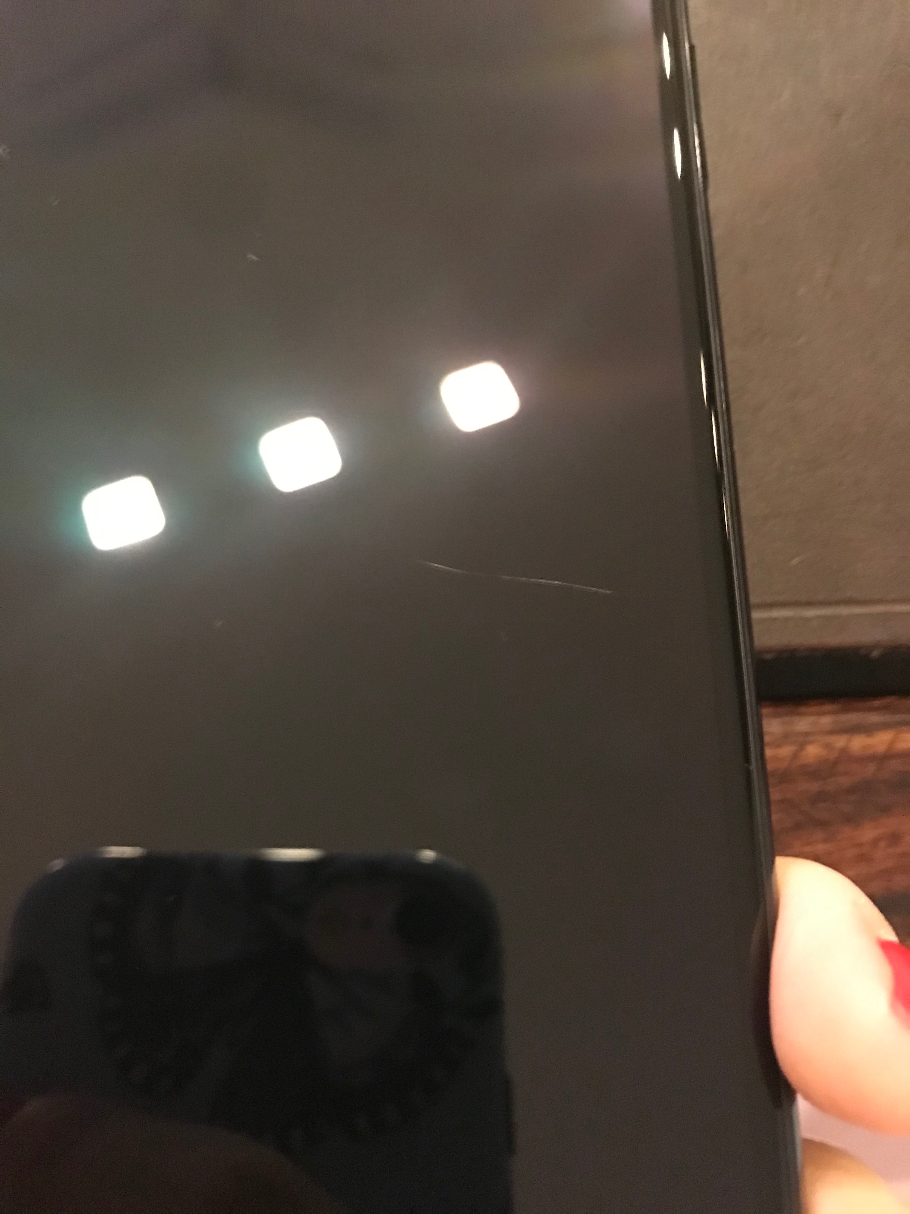 Does Apple replace scratched phones?