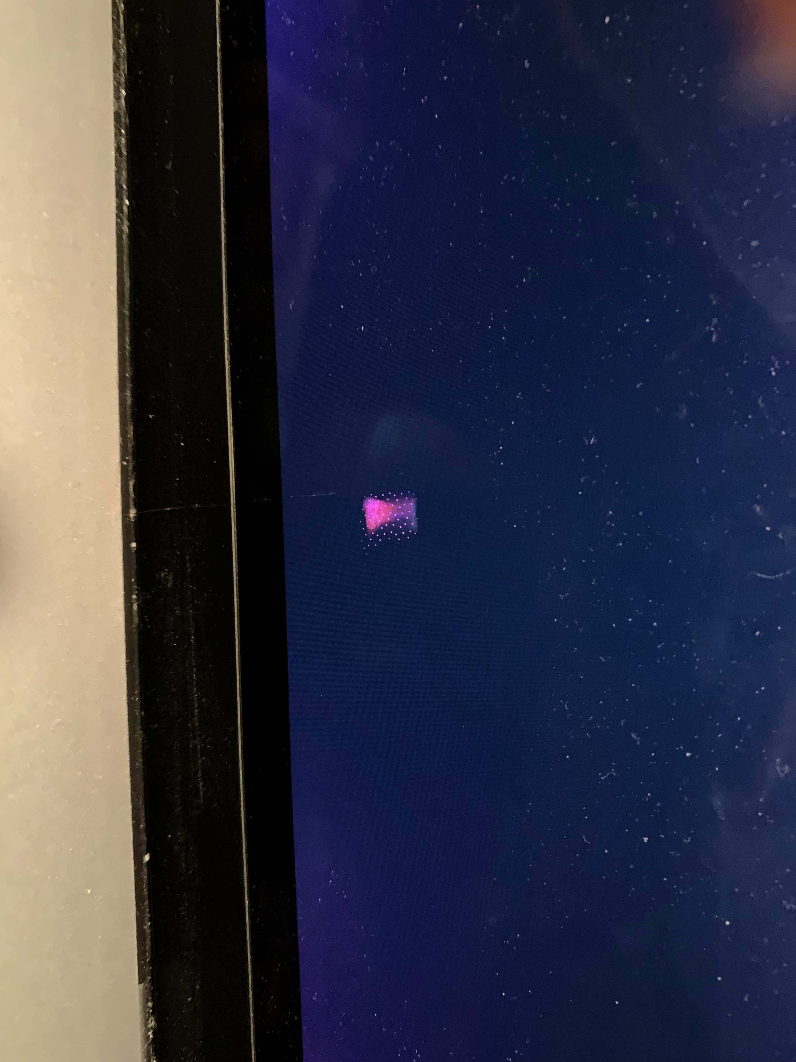 Dead pixels? Bright pink dots on screen - Apple Community