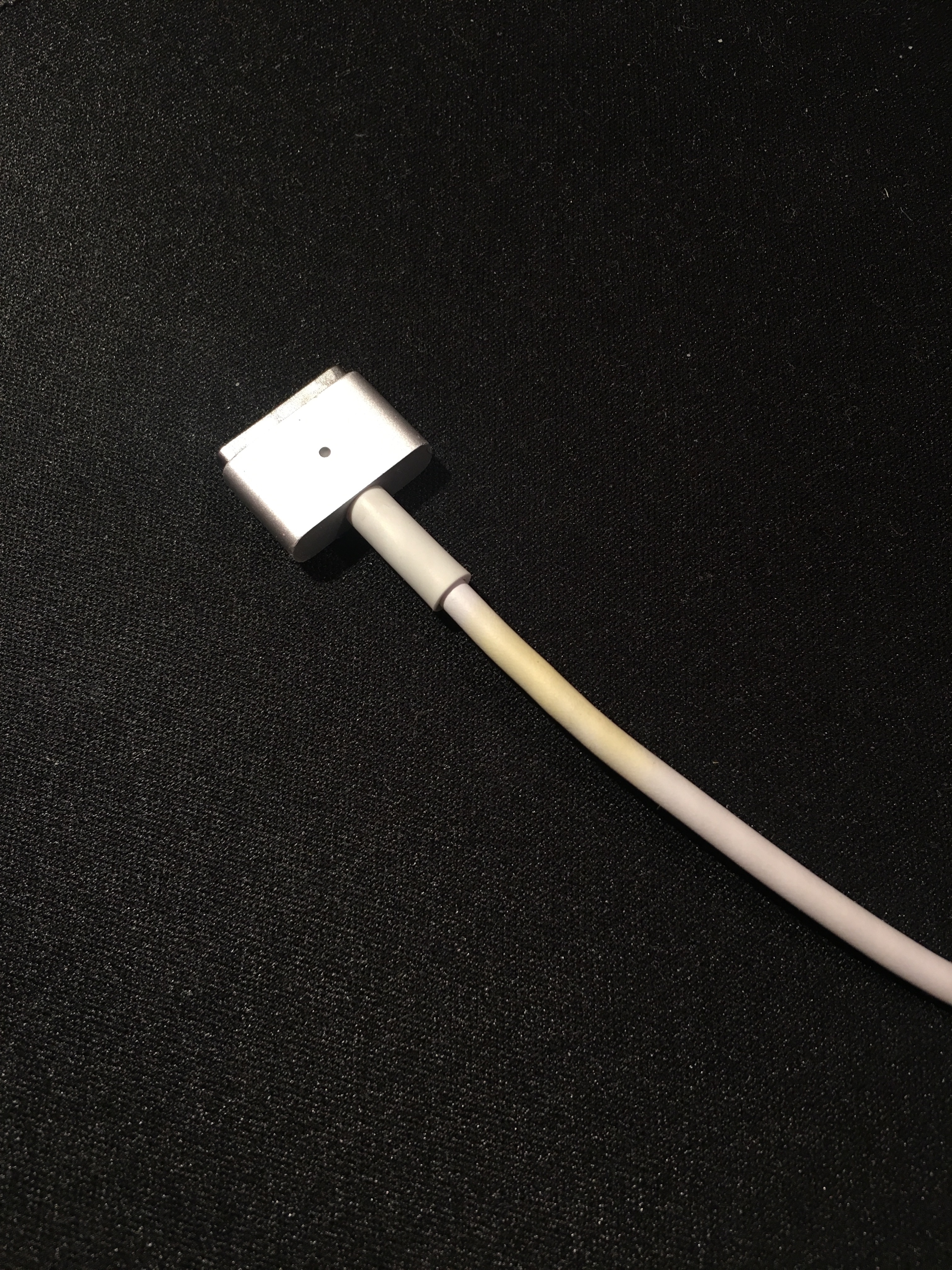 My Magsafe cord is turning yellowish - Apple Community