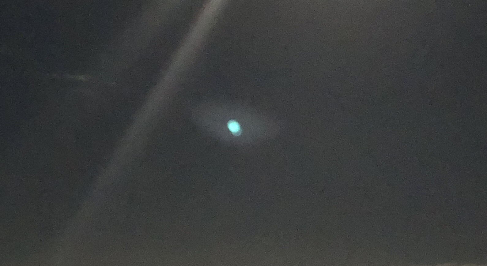 I have a white dot on several photos on m… Apple Community