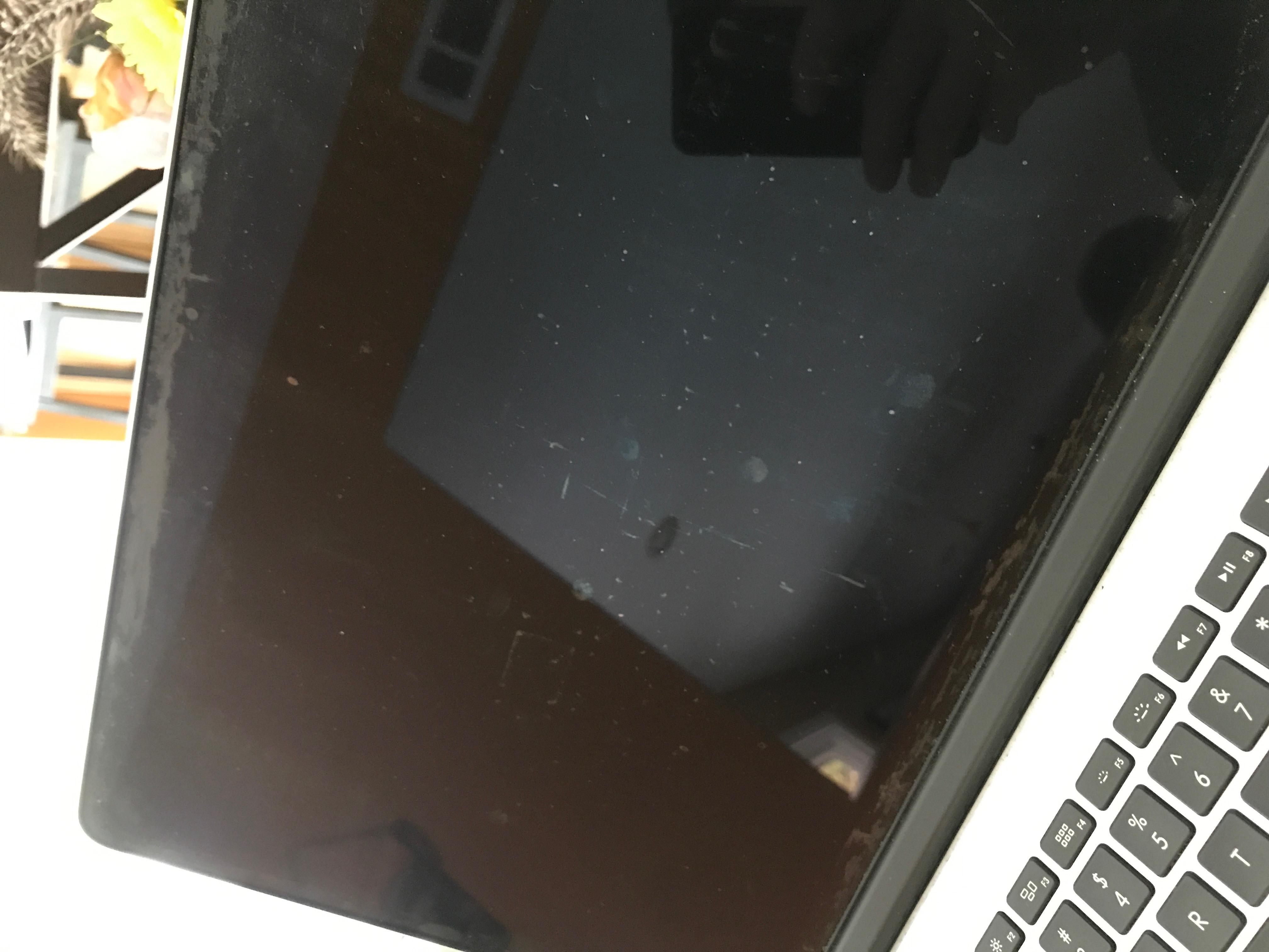 will apple replace my macbook screen coating