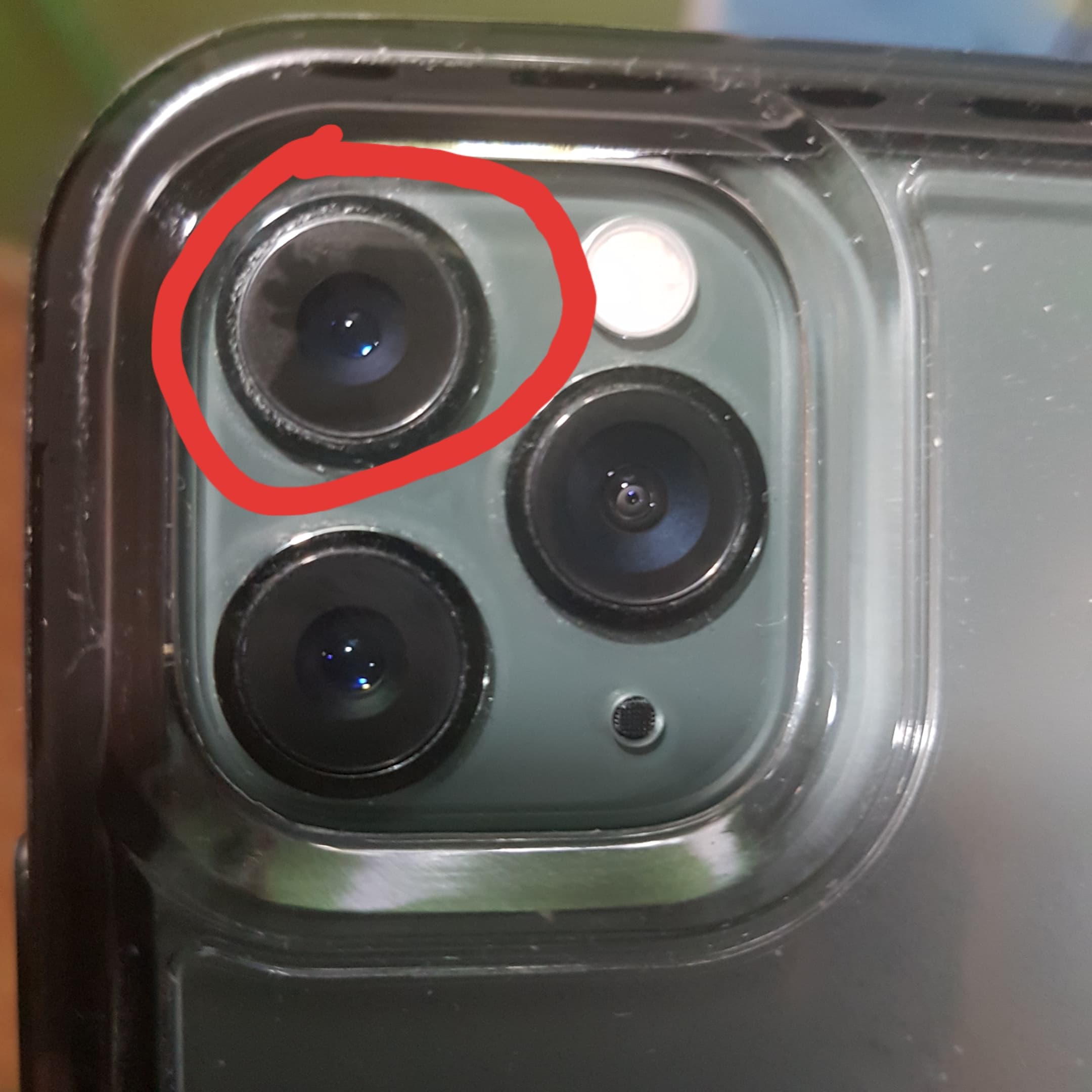 What happens if I scratch my iPhone camera?
