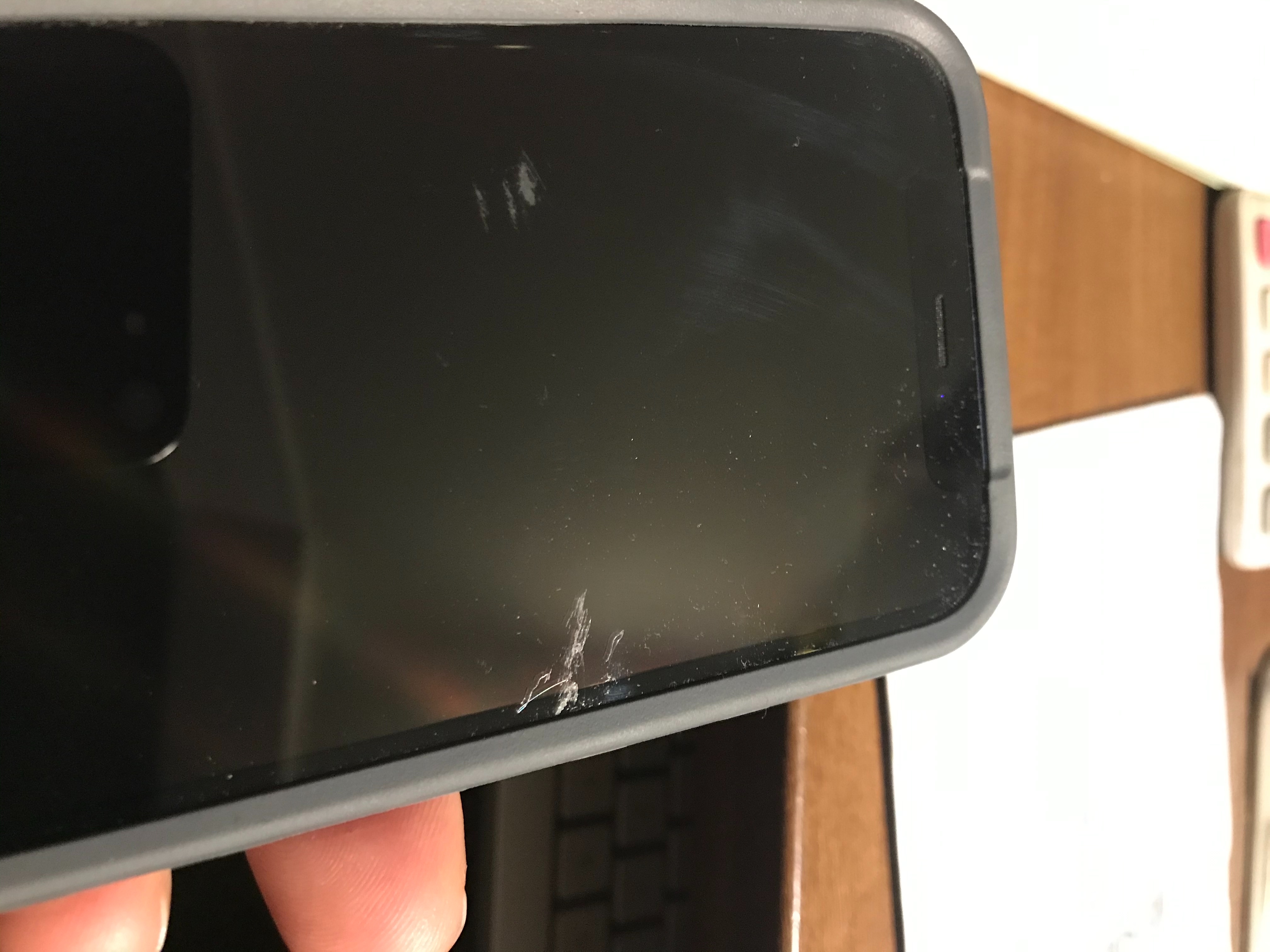 Brand new phone with screen scratch - Apple Community