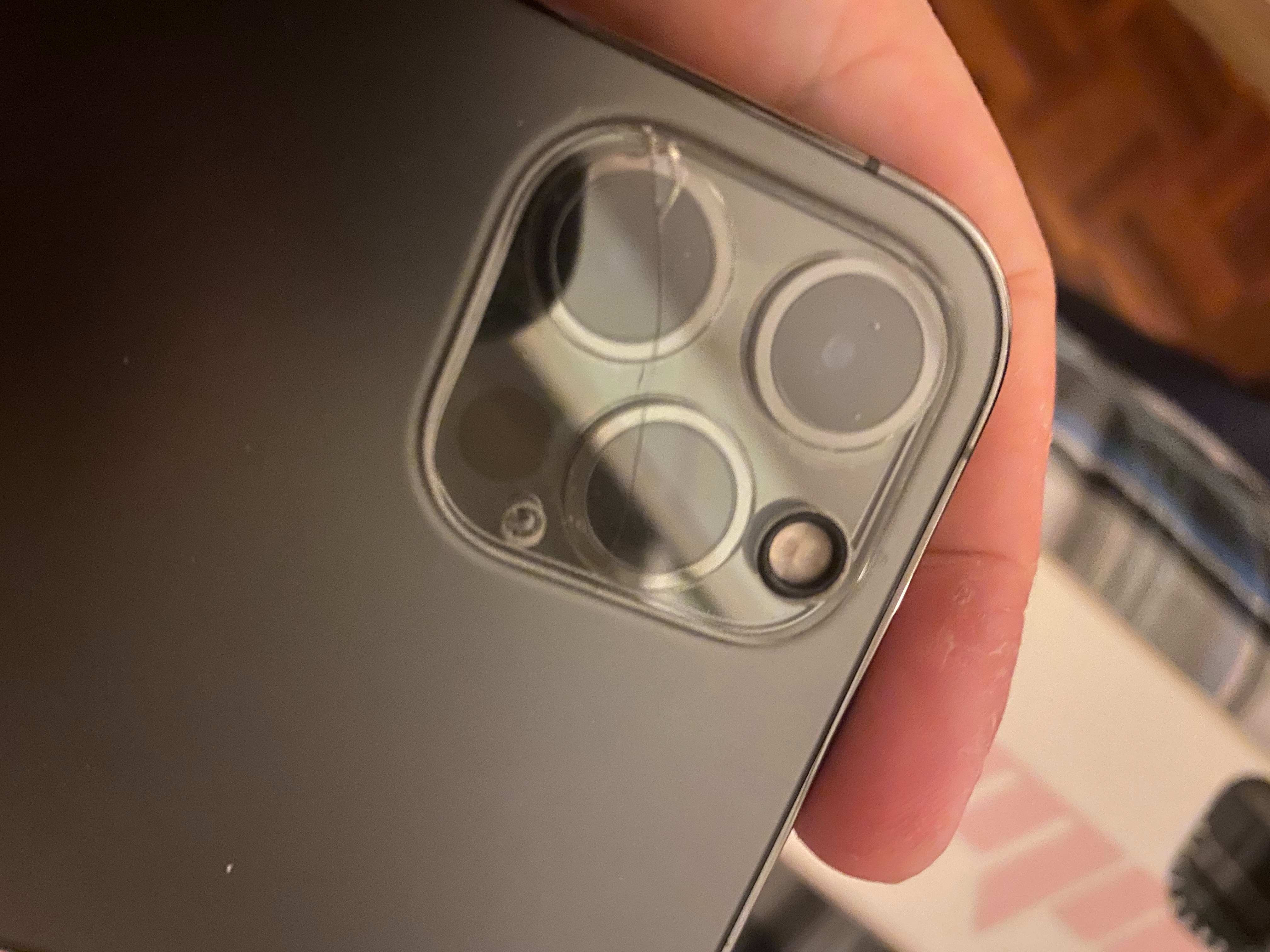 iphone 14 pro camera lens cracked - how easily fixable is this